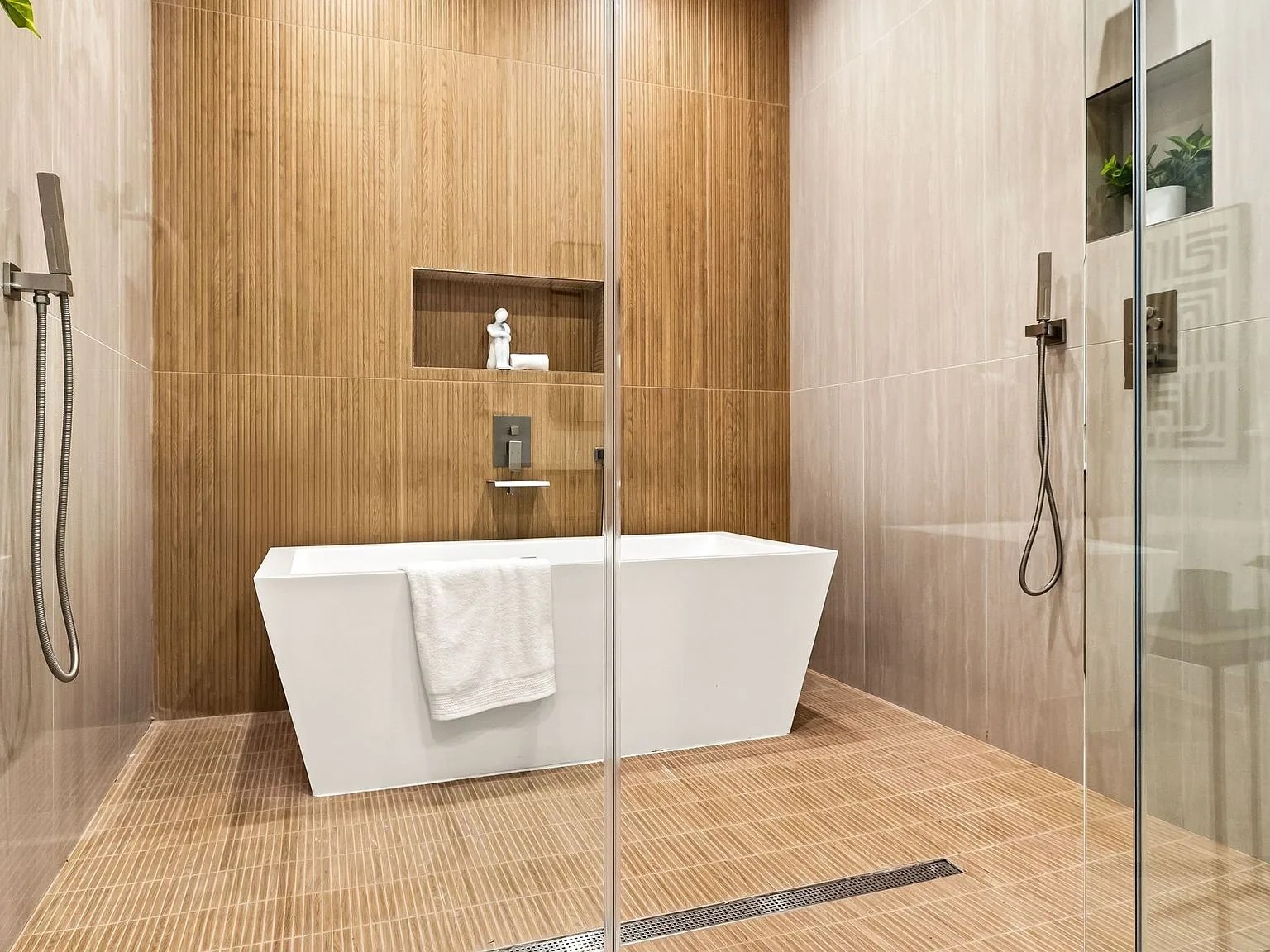 Primary bathroom with quiet neutral materials in a Dallas residence